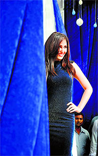 Pooja Chopra, Miss India World 2009, poses during the launch of a suiting collection in Ludhiana on Sunday.