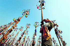 Indonesians participate in a local competition called panjat pinang in which people try to climb greased poles that have prizes attached to the top, during an event to celebrate Indonesias Independence Day in Jakarta on Sunday.