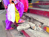 Broken stairs of the railway station overbridge in Bathinda. Tribune photo
