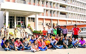 NSUI workers raise slogans outside Girls' Hostel No. 8 of Panjab University, Chandigarh, on Monday.