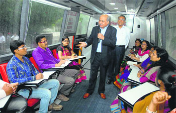 Out-of-box thinking yields rich dividends. The Director of the Coca-Cola University, RC Datta, taking classes of the retailers in the bus, during the inauguration of the first University on Wheels, aimed to empower rural retailers in business skills