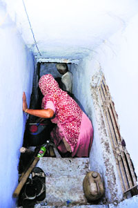 A family rushes to take refuge in a bunker in their house in Pindi Charkan village in RS Pura sector in Jammu.