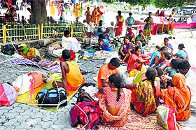 Stranded passengers at the Jammu railway station on Monday.