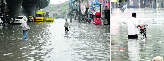Residents wade through flooded roads in Ludhiana.