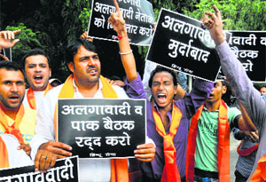 Hindu Sena actvists protest outside the Pakistan High Commission in New Delhi on Monday.