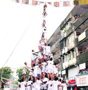 Govindas break a handi in Mumbai on Monday.