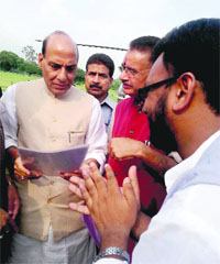 MLA Ganesh joshi presents a memorandum to Home Minister Rajnath Singh in Mussoorie on Monday