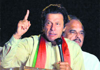 Imran Khan addresses his supporters during a protest march in Islamabad on Monday.