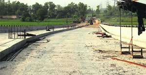 A view of the railway overbridge where the work is going on in full swing on the Badal-Malout Road in Bathinda.