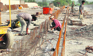 Work in progress at the railway overbridge on Badal-Malout Road in Bathinda.