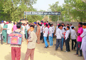 Students along with villagers protest outside the government school demanding potable water at Jagaram Tirath village in Bathinda on Tuesday.