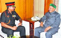 Lt Gen Sanjeev Madhok, AVSM, VSM, General Officer Commanding-in-Chief, ARTRAC, calls on Chief Minister Virbhadra Singh in Shimla on Tuesday. Tribune photo