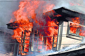 Flames rise from a building after a fire broke out at MA Road in Srinagar on Tuesday. 