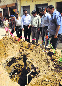 health officials visit a site for suspected water contamination