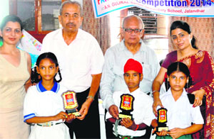 participants at the painting competition being honoured by the District Child Welfare Council at the AN Gujral Senior Secondary School in Jalandhar on Tuesday.