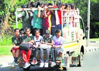 Participants being ferried in an overcrowded mini truck in Ludhiana on Tuesday. 
