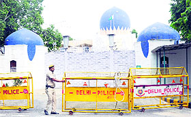 A policeman barricades the entrance of the Pakistan High Commission in New Delhi on Tuesday.