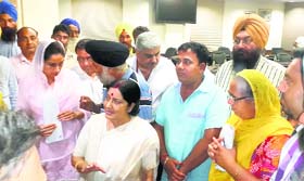 Kin of Punjabi youths abducted in Iraq meet Sushma Swaraj and Harsimrat Kaur Badal in New Delhi on Tuesday.
