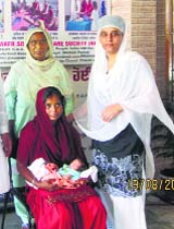 The affected woman with her newborn in Ropar.
