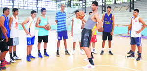 Satnam Singh Bhamara interacts with the budding cagers at the Ludhiana Basketball Academy, the place where he learnt his first lessons in the sport.