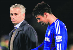 Chelseas manager Jose Mourinho speaks with Diego Costa after their EPL match against Burnley on Monday. 