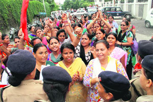 ASHA workers protest in support of their demands at the Civil Secretariat in Dehradun on Tuesday. 