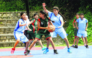 A match in progress in the Dehradun District Basketball Under-16 Tournament played at The Aryan School in Dehradun on Tuesday
