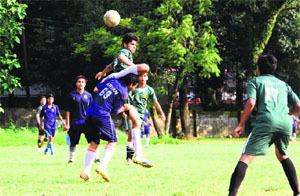 Players vie for the ball during a match in the Inter School Boys/Girls Football Tournament played at Gorkha Military College in Dehradun on Tuesday