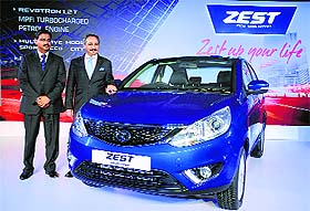 Tata Motors president (Passenger Vehicle Business Unit) Ranjit Yadav (R) and senior vice-president Girish Wagh pose with Zest car at its launch in New Delhi on Wednesday.