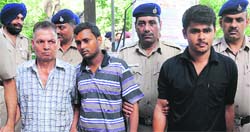 The accused being taken to the court from Sector 19 police station in Chandigarh on Wednesday. Tribune photo: Manoj Mahajan