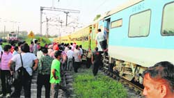 Passengers alight from the AC coach of the Chandigarh-Amritsar Intercity Express near the Chandigarh railway station on Wednesday. A Tribune photograph