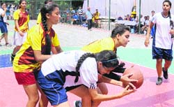 Girls of the YPS and Manav Mangal Smart School vie for the ball during the semifinal match of the Sardar Bhagwant Singh Memorial Basketball Tournament at Vivek High School, Sector 70, Mohali, on Wednesday. Tribune photo: Vicky Gharu