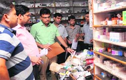 UT Excise and Taxation officials conduct a surprise check at a chemist shop at the GMSH, Sector 16, in Chandigarh on Wednesday. Tribune Photo: Manoj Mahajan