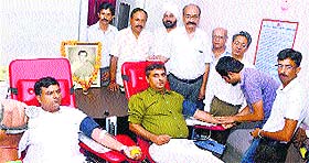 Congress workers donate blood on the occasion of the birth anniversary of former Prime Minister Rajiv Gandhi at the district hospital in Una on Wednesday.