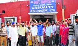 Relatives of the pregnant woman, who died at Government Hospital, Gandhi Nagar, protest in Jammu on Wednesday. Tribune photo: Inderjeet Singh