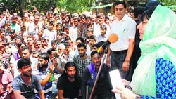 PDP president Mehbooba Mufti addresses party workers during her roadshow in Shopian on Wednesday. Tribune photo: Amin War