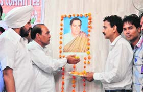 Congress leaders observe the birth anniversary of former PM Rajiv Gandhi in Ludhiana on Wednesday