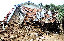 A destroyed house after a landslide hit Hiroshima, Japan, on Wednesday