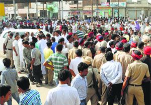A crowd in Rama Mandi after a firing incident was reported in Talwandi Sabo on Thursday.