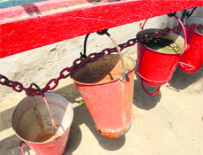 Empty buckets show the inadequate arrangements at the railway station in Bathinda on Thursday.