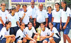 The girls (U-16) team of Yadavindra Public School with the trophy at Vivek High School, Sector 70, Mohali, on Thursday. A tribune photograph