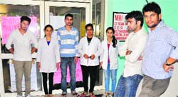 Students stand in front of the OPD during their protest at Shri Dhanwantary Ayurvedic College and Hospital, Sector 46, in Chandigarh on Thursday. Tribune photo: Parvesh Chauhan