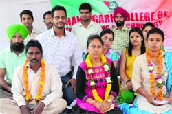 Members of the Chandigarh College of Engineering and Technology Employees Union sit on a hunger strike on Thursday. Tribune photo: Manoj Mahajan