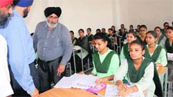 Punjab Education Minister Daljit Singh Cheema interacts with students of the residential school for meritorious students at Sector 70 in Mohali on Thursday. Tribune photo: Vicky Gharu