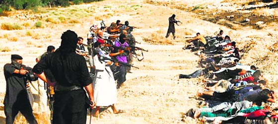 A verified file photo of militants of the Isis taking aim at captured Iraqi soldiers in plain clothes after taking over Tikrit