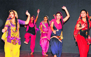 Students of Innocent Hearts College of Education perform giddha during a talent hunt programme, Parichay-2014, in Jalandhar on Thursday.