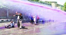 Police use water cannons to disperse PHE employees in Srinagar on Thursday.