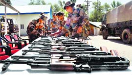The Army displays arms and ammunition recovered from a car in Bandipore on Wednesday night.