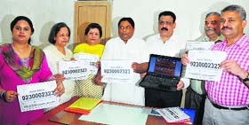 Reaching out: Senior leaders of the IT cell of the BJP at the launch of the official mobile number for the public in Jammu on Thursday.