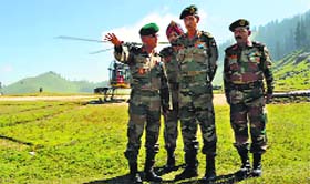Chinar Corps Commander Lt Gen Subrata Saha briefs Northern Command chief Lt Gen DS Hooda at the Tosa Maidan in Budgam on Thursday.